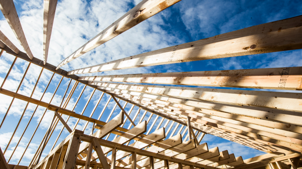 Wooden house framing under construction – PayLocker ensures secure construction payment security for builders and contractors.