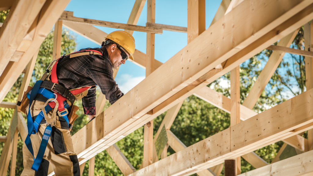Construction worker securing a wooden frame – PayLocker ensures secure payments for builders and contractors.
