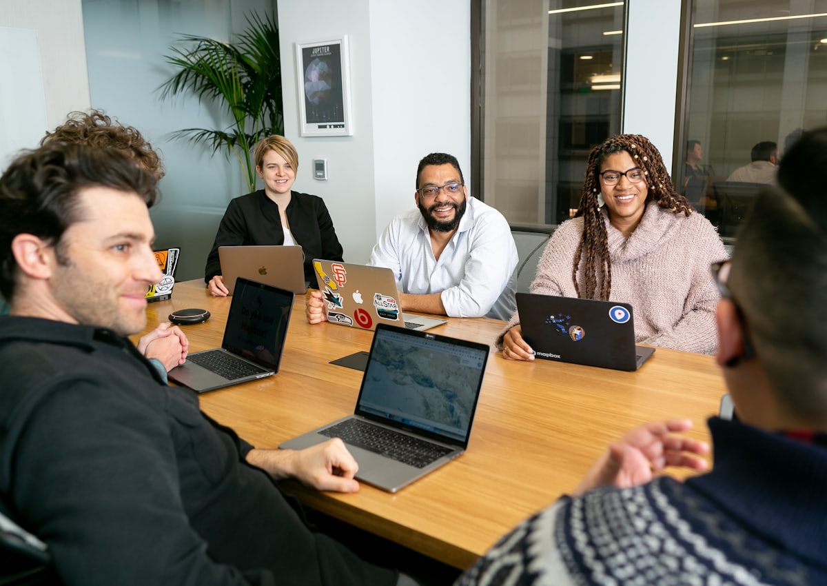Australian construction and professional services team in discussion around a meeting table