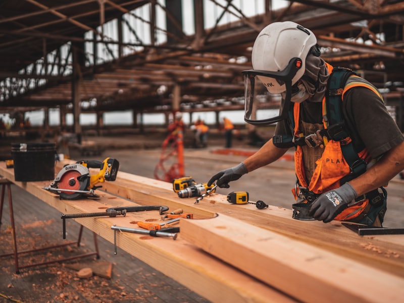 Australian site supervisor reviewing build progress against the project's payment and claim position
