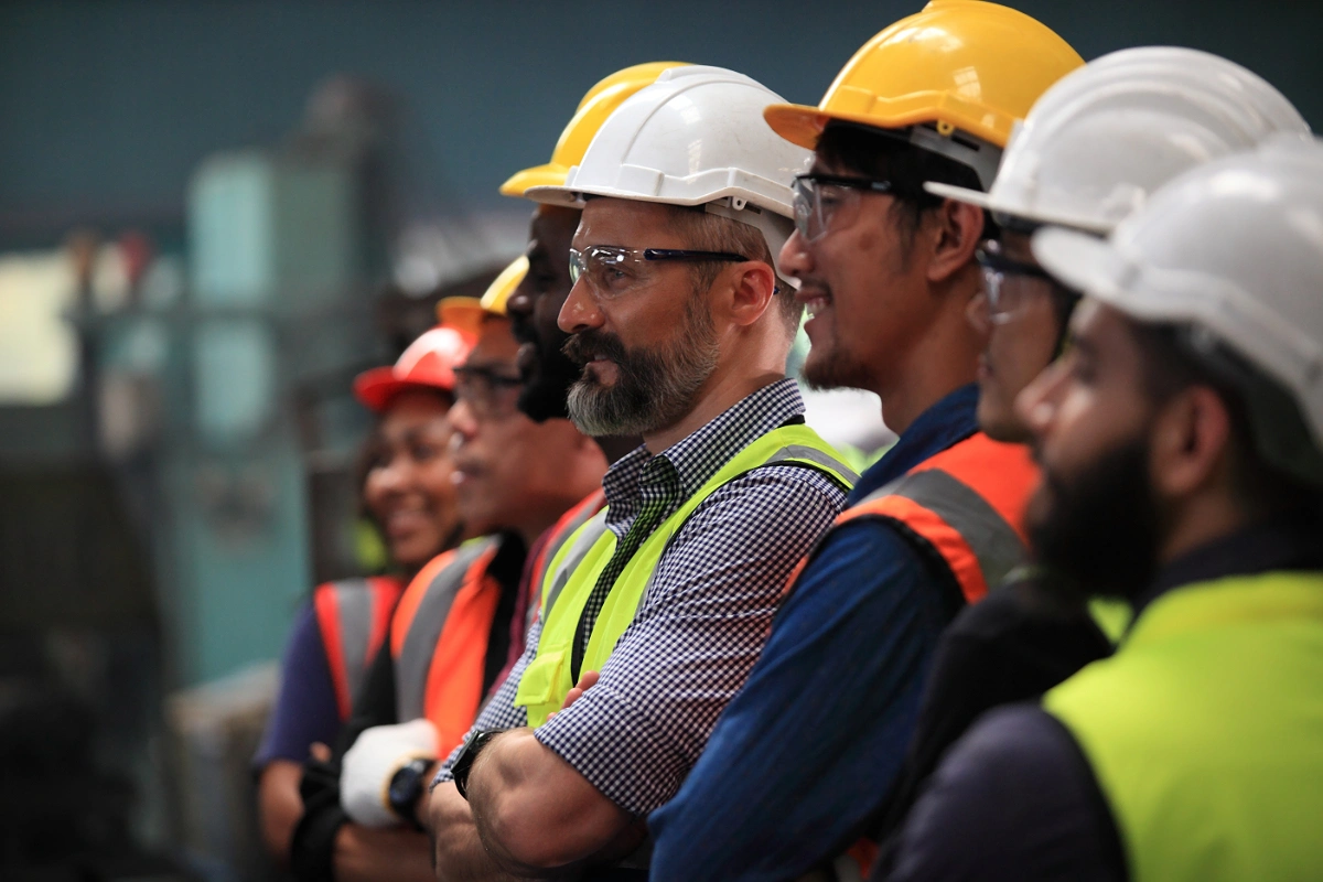 Construction team in hard hats and high-visibility vests on site