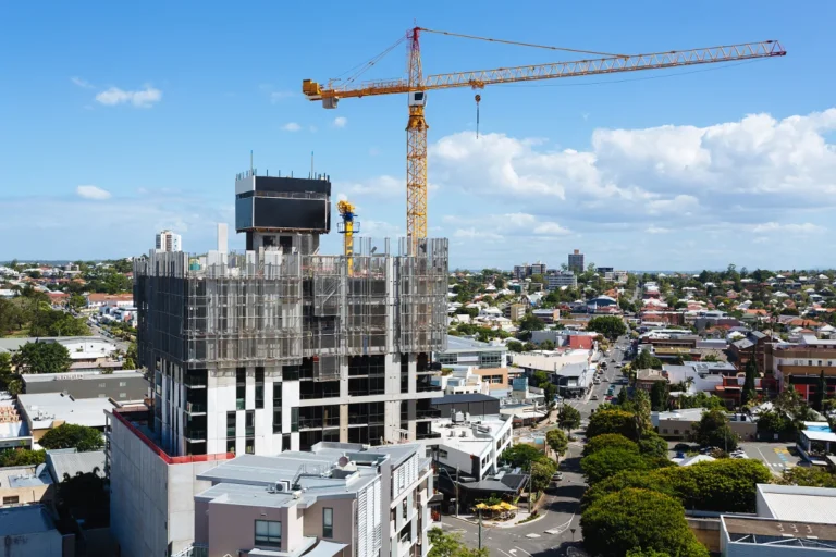 Aerial view of tower cranes over an Australian city construction precinct